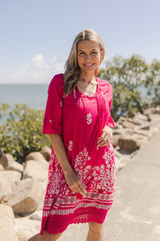 Model Genericm wearing size sample of the Hannah Cotton Dress - Pink in colour Pink, in a cropped view