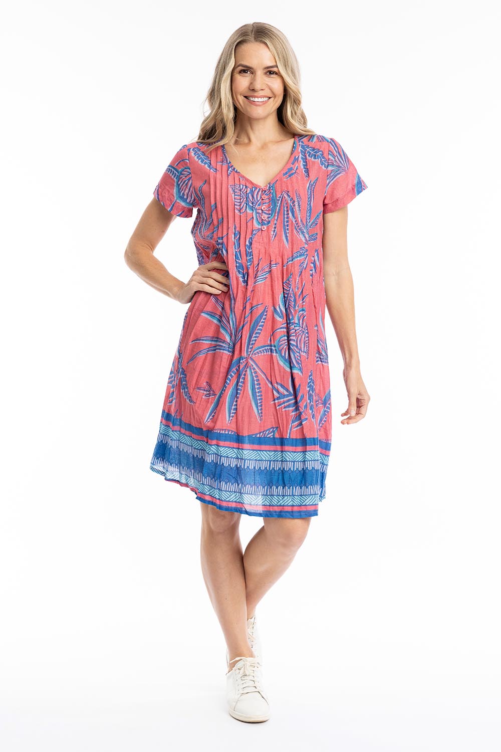 Model Genericm wearing size sample of the Nicola Cotton Dress - Coral in colour Coral, from the front