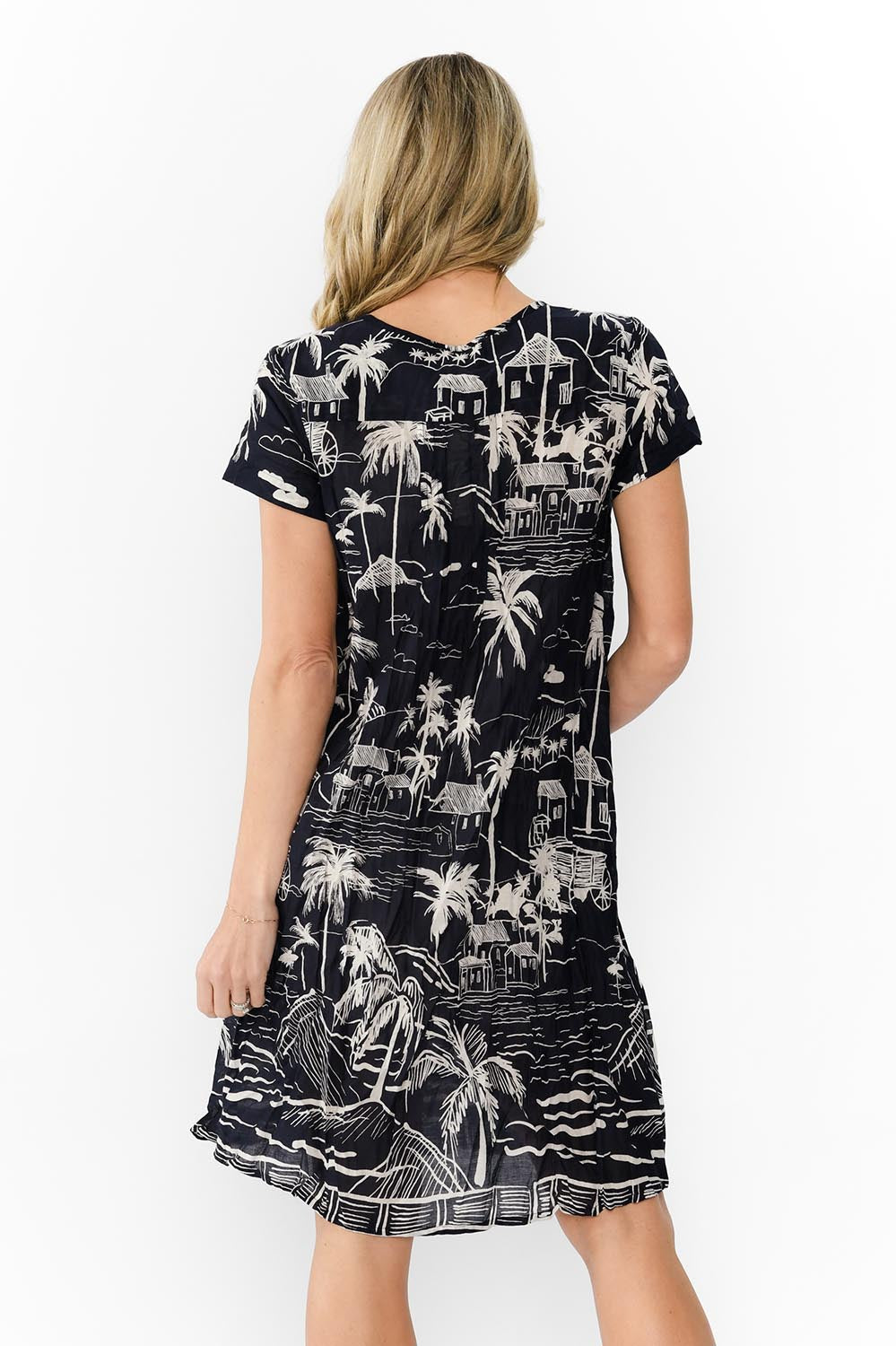 Model Genericm wearing size sample of the Nicola Cotton Dress - Navy in colour Navy, from the back