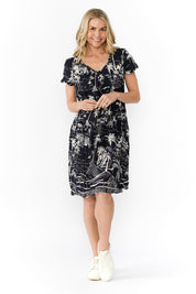 Model Genericm wearing size sample of the Nicola Cotton Dress - Navy in colour Navy, from the front