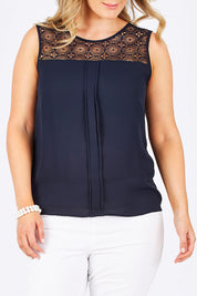 Model Jess wearing the Venice Lace Top in colour NightSky (Blue), from the front, cropped image