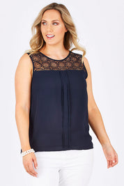 Model Jess wearing the Venice Lace Top in colour NightSky (Blue), from the front, cropped image