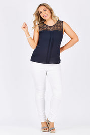 Model Jess wearing the Venice Lace Top in colour NightSky (Blue), from the front, showing the whole outfit