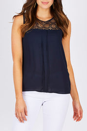 Model Madeline wearing the Venice Lace Top in colour NightSky (Blue), from the front, cropped image