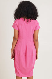 Model Ziara wearing size 10 of the Essentials Organic Cotton Bubble Dress in colour Pink (Pink), from the back