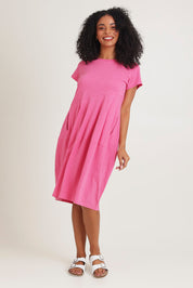 Model Ziara wearing size 10 of the Essentials Organic Cotton Bubble Dress in colour Pink (Pink), from the front, showing the whole outfit