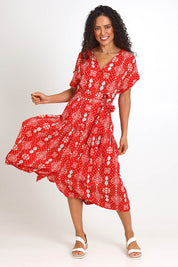 Model Pamelar wearing size 10 of the V-Neck Button Through Dress – Print in colour Print, from the front