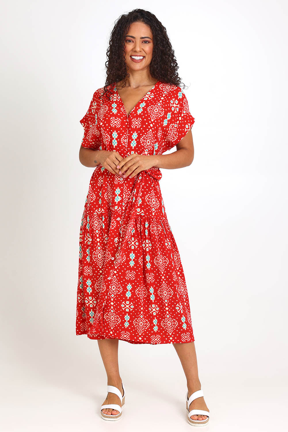 Model Pamelar wearing size 10 of the V-Neck Button Through Dress – Print in colour Print, from the front
