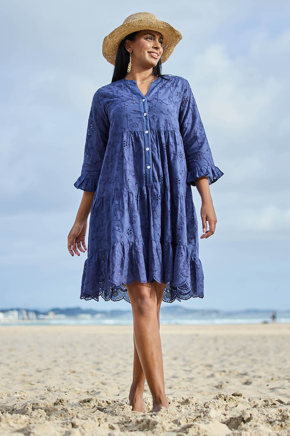 Model Eshan wearing size 10 of the Essentials Broderie Frill Hem and Sleeves Dress - Navy in colour Navy, from the front