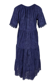 Product shot of the Essentials Broderie Layers Dress - Navy in colour Navy, from the back