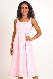 Model Pamelar wearing size 10 of the Essentials Broderie Strappy Cotton Dress - Pink in colour Pink, in a cropped view