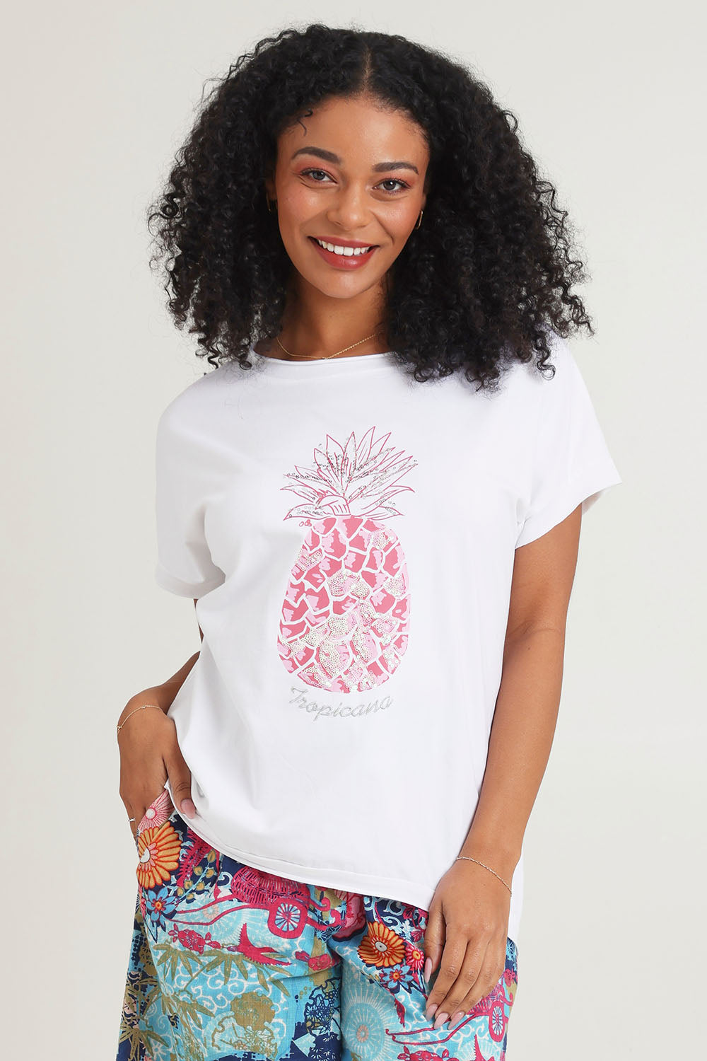 Model Ziara wearing size 10 of the Embellished Cotton Tee in colour Whitepine, from the front, cropped image