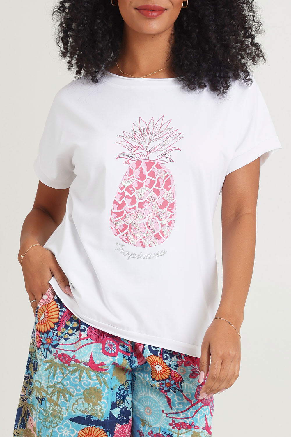 Model Ziara wearing size 10 of the Embellished Cotton Tee in colour Whitepine, from the front, cropped image