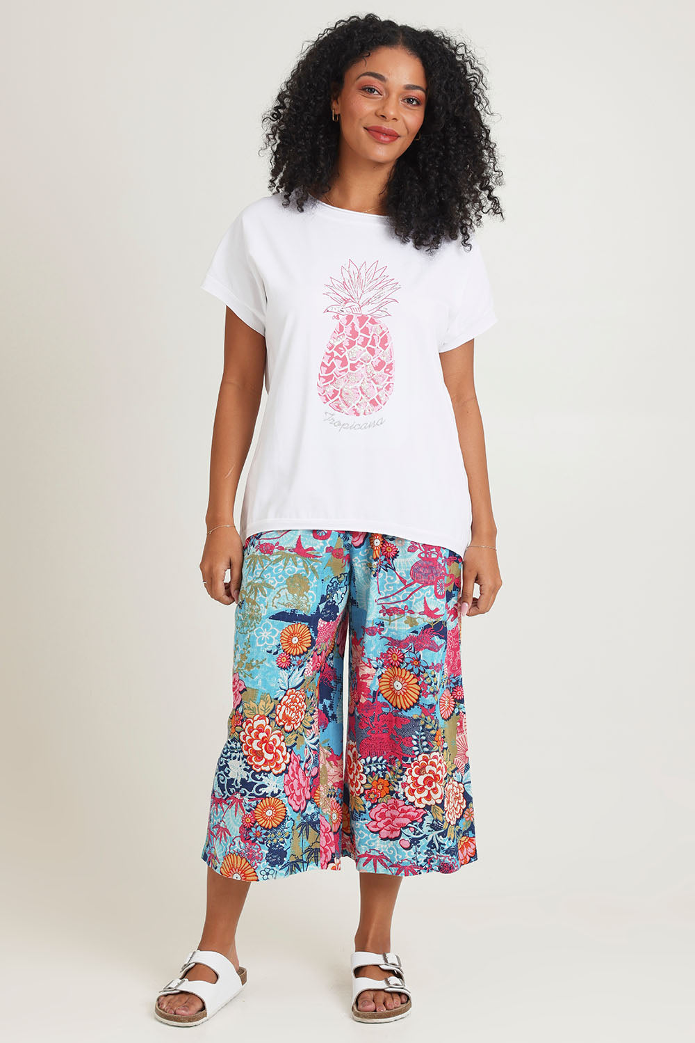 Model Ziara wearing size 10 of the Embellished Cotton Tee in colour Whitepine, from the front, showing the whole outfit