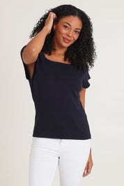 Model Ziara wearing size 10 of the Essentials Squareneck Knit Cotton Top in colour Navy (Blue), from the front, cropped image