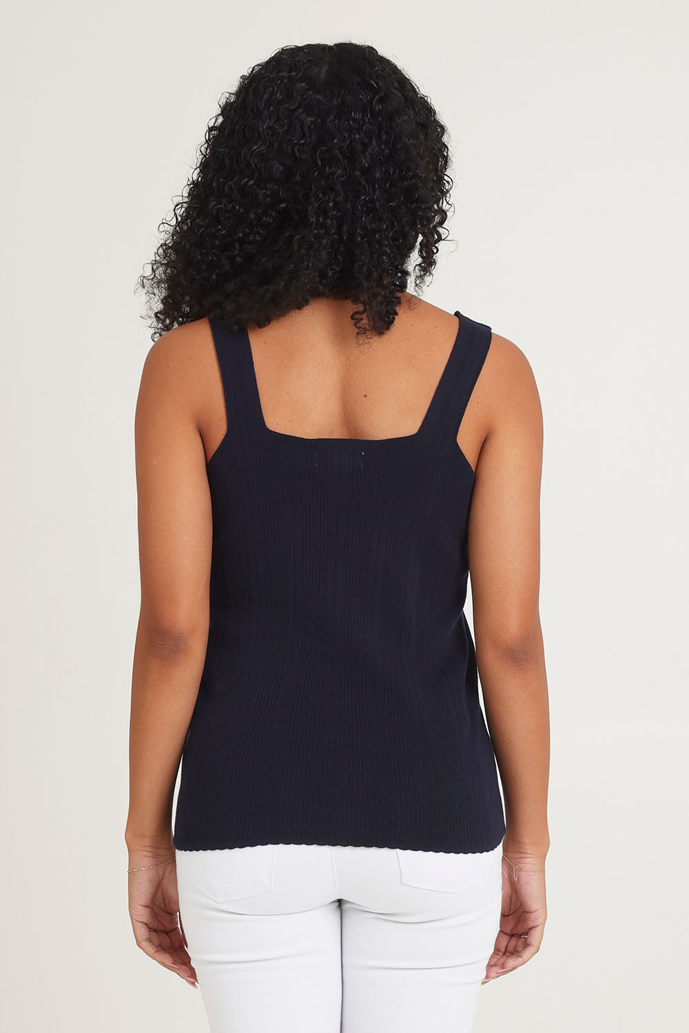 Model Ziara wearing size 10 of the Essentials Squareneck Knit Cotton Tank in colour Navy (Blue), from the back