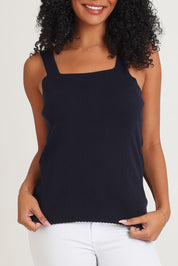 Model Ziara wearing size 10 of the Essentials Squareneck Knit Cotton Tank in colour Navy (Blue), from the front, cropped image
