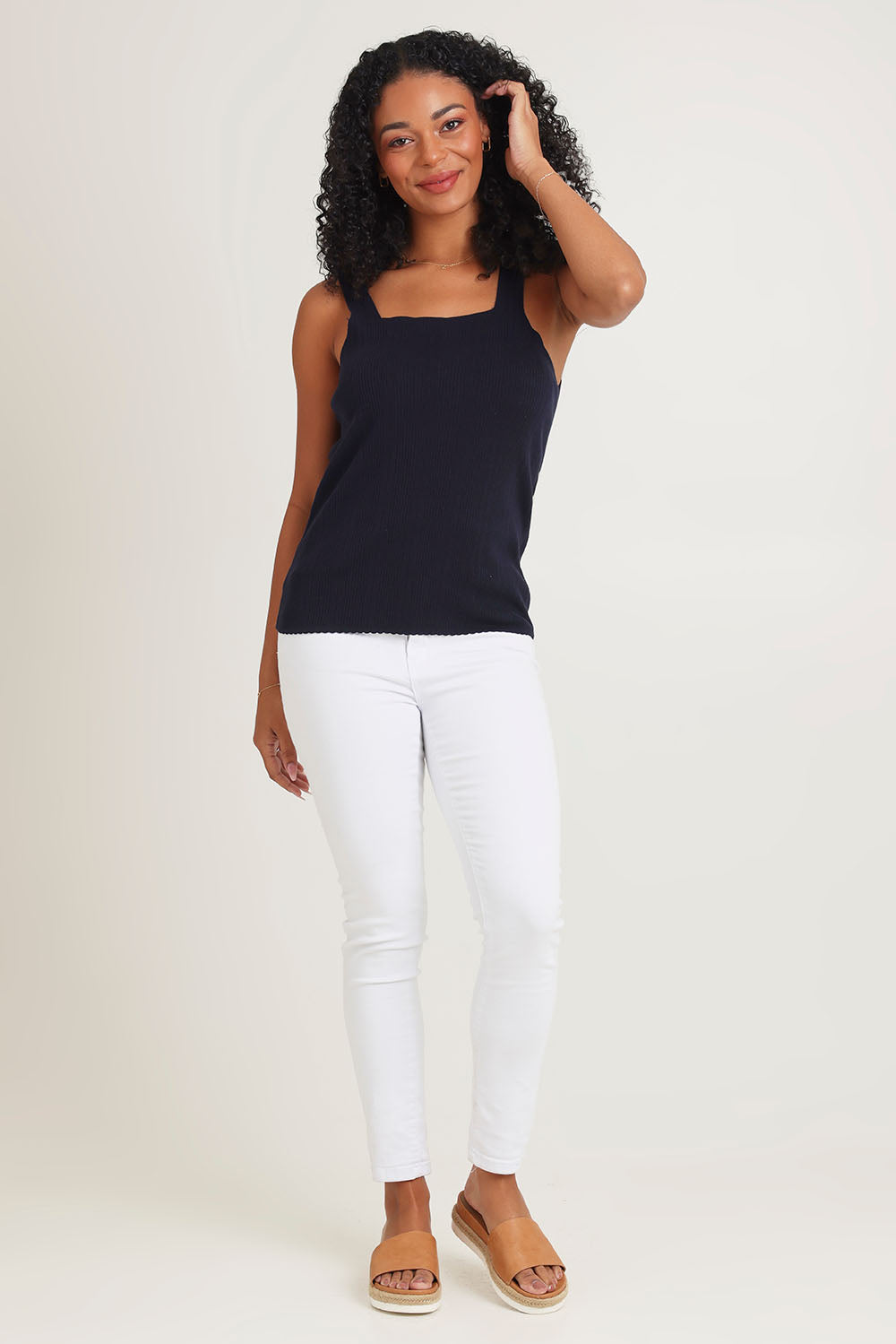 Model Ziara wearing size 10 of the Essentials Squareneck Knit Cotton Tank in colour Navy (Blue), from the front, showing the whole outfit