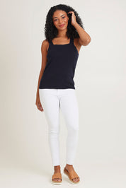 Model Ziara wearing size 10 of the Essentials Squareneck Knit Cotton Tank in colour Navy (Blue), from the front, showing the whole outfit