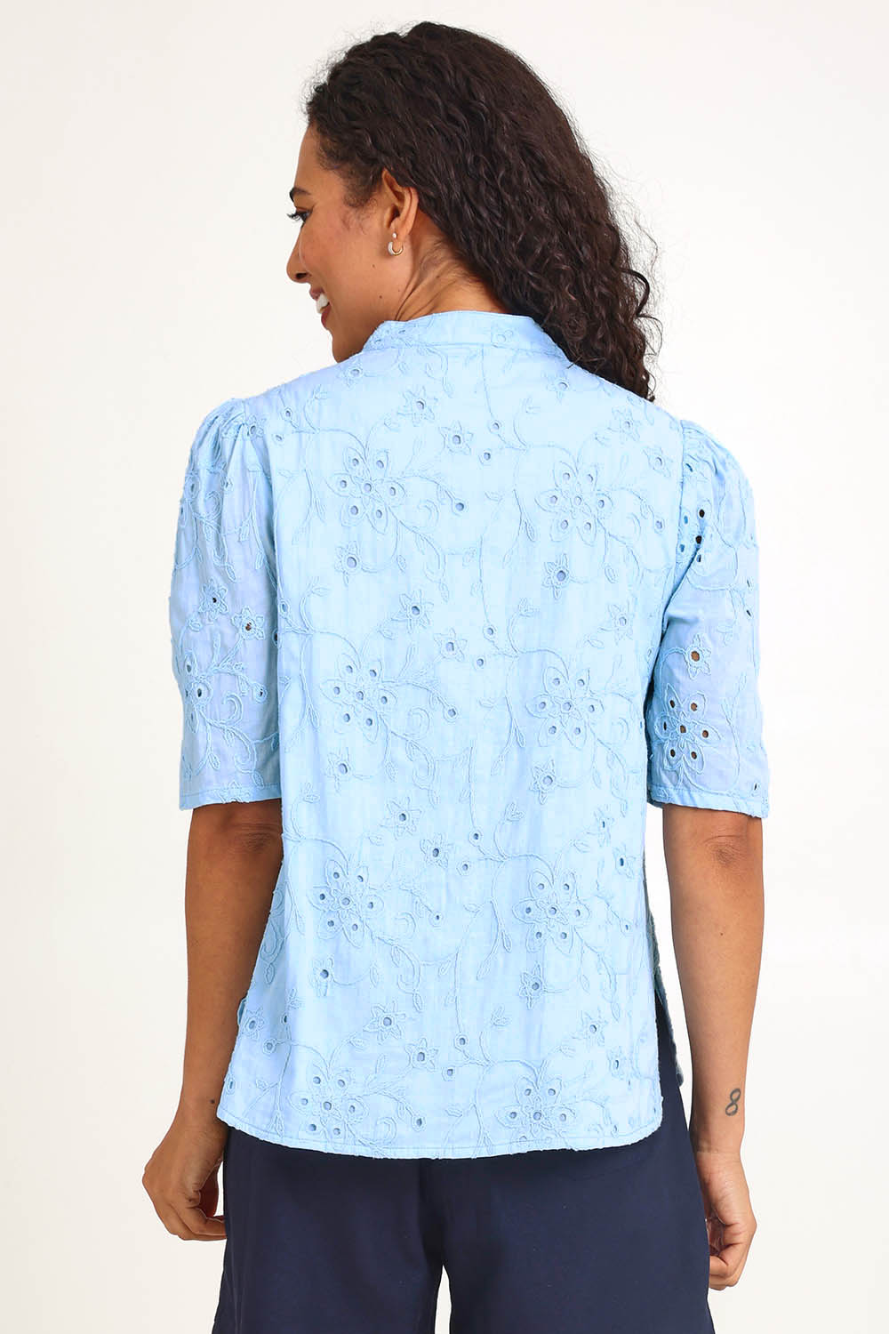 Model Pamelar wearing size 10 of the Essentials Broderie Cotton Top - Sky in colour Sky, from an angle
