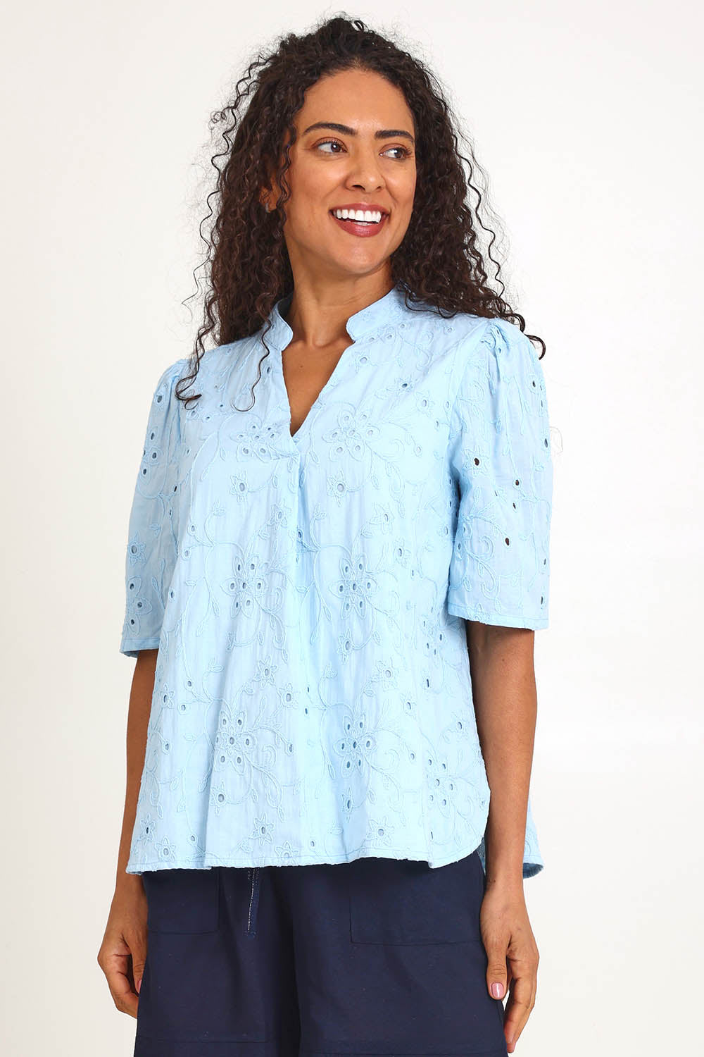 Model Pamelar wearing size 10 of the Essentials Broderie Cotton Top - Sky in colour Sky, in a cropped view