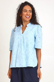 Model Pamelar wearing size 10 of the Essentials Broderie Cotton Top - Sky in colour Sky, in a cropped view