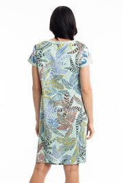 A model wearing the Fitzroy  Organic Cotton Patch Dress in colour Print (Blue), from the back