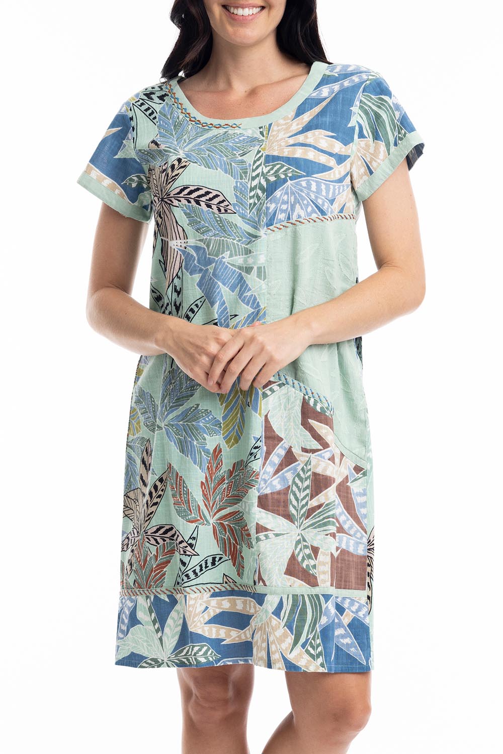 A model wearing the Fitzroy  Organic Cotton Patch Dress in colour Print (Blue), from the front, cropped image
