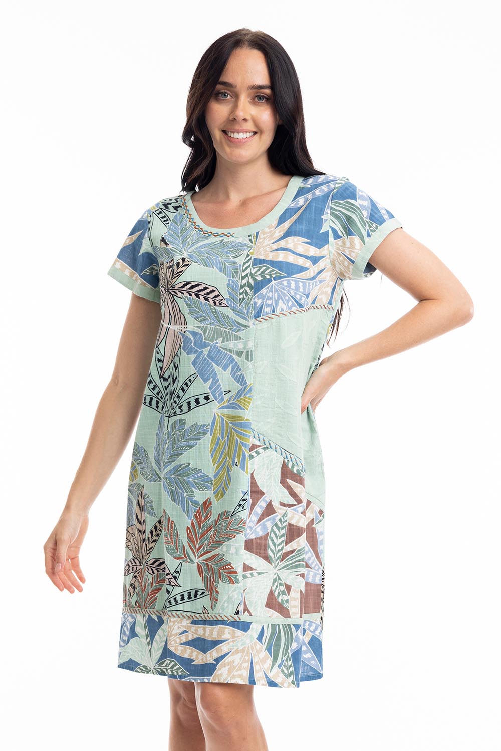 A model wearing the Fitzroy  Organic Cotton Patch Dress in colour Print (Blue), from the front, cropped image