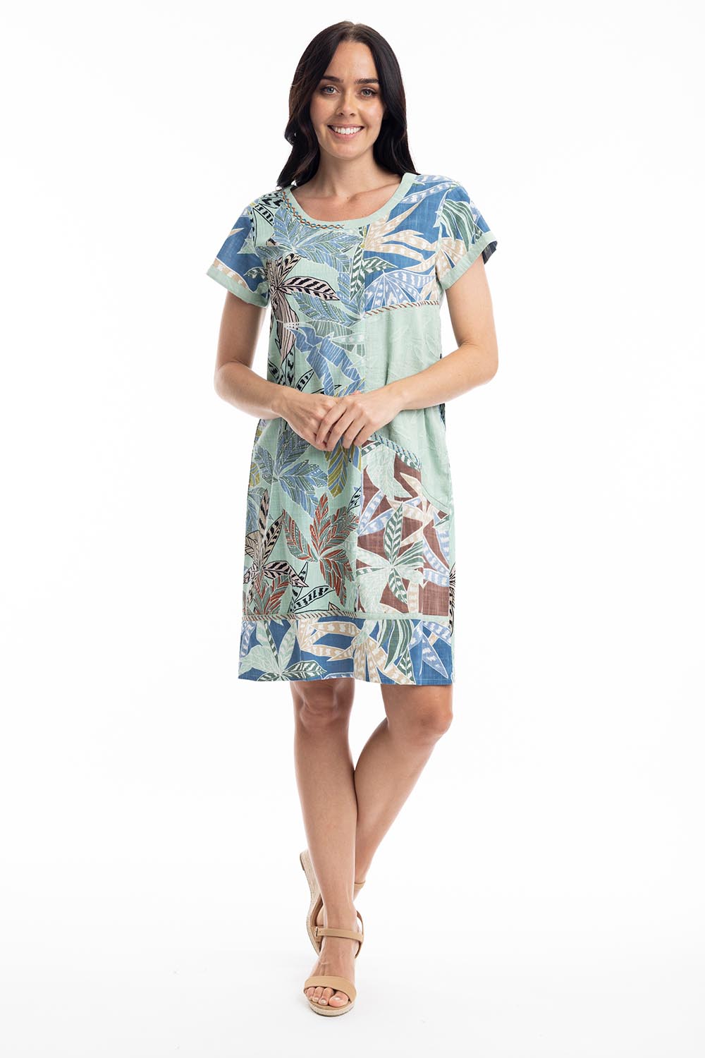 A model wearing the Fitzroy  Organic Cotton Patch Dress in colour Print (Blue), from the front, showing the whole outfit