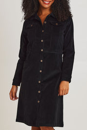 Model Ziara wearing size 10 of the Cotton Corduroy Button Dress in colour Black (Black), from the front, cropped image