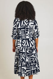 Model Ziara wearing size 10 of the Corduroy Cotton Collar Dress in colour Navy (Blue), from the back