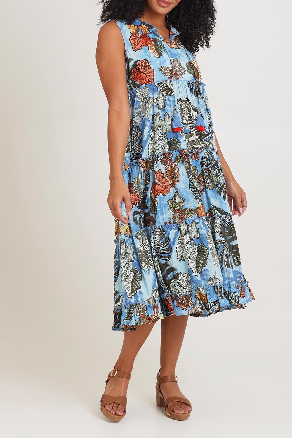 Model Ziara wearing size 10 of the Cotton Sleeveless Layers Dress in colour Lima (Blue), from the front, cropped image
