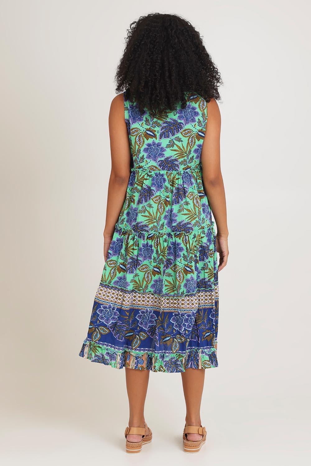 Model Ziara wearing size 10 of the Sleeveless Layers Cotton Dress in colour Lascuevas, from the back