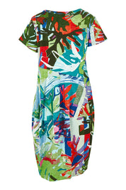 Product shot of the Short Sleeve Bubble Cotton Dress in colour Leavesblue, from the back