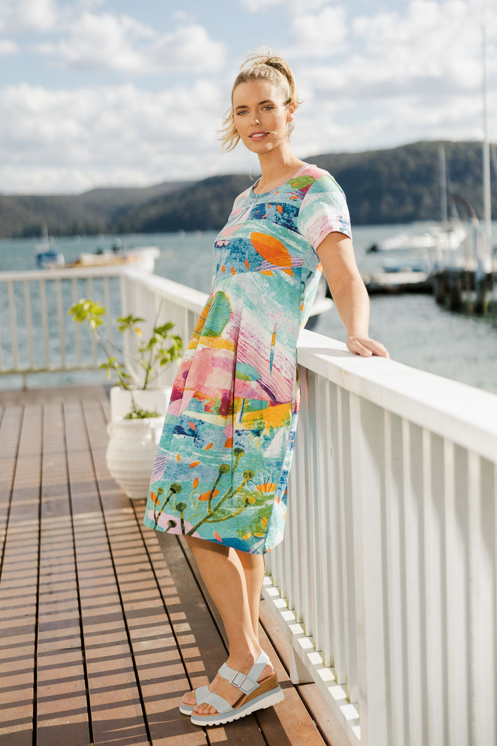Model Phoebe wearing size 10 of the Printed Bubble Organic Cotton Dress in colour Dreamland (Blue), from the front, showing the whole outfit
