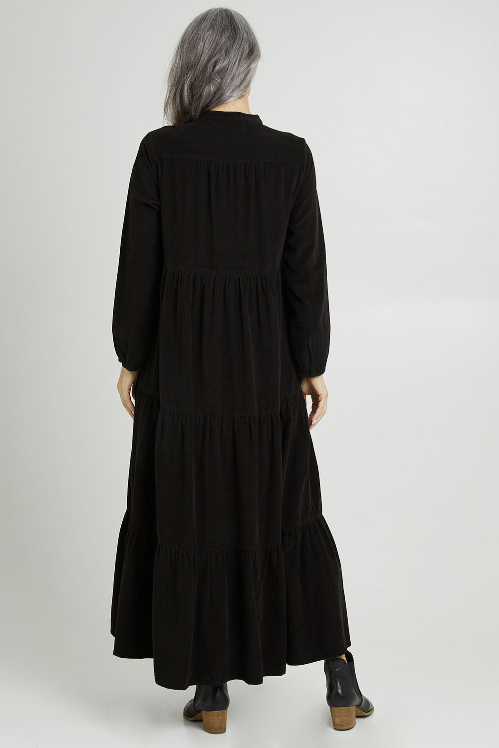 Model Luisa wearing size 10 of the Essentials Cord Layered Maxi Dress in colour Black (Black), from the back