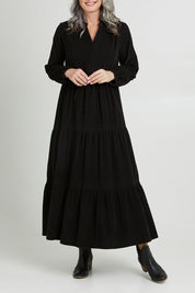 Model Luisa wearing size 10 of the Essentials Cord Layered Maxi Dress in colour Black (Black), from the front, cropped image