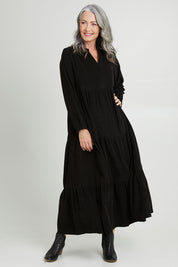 Model Luisa wearing size 10 of the Essentials Cord Layered Maxi Dress in colour Black (Black), from the front, showing the whole outfit