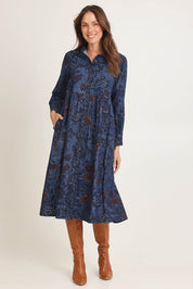 Model Madeline wearing size 10 of the Midi Collar Dress in colour Tabriz (Blue), from the front, showing the whole outfit