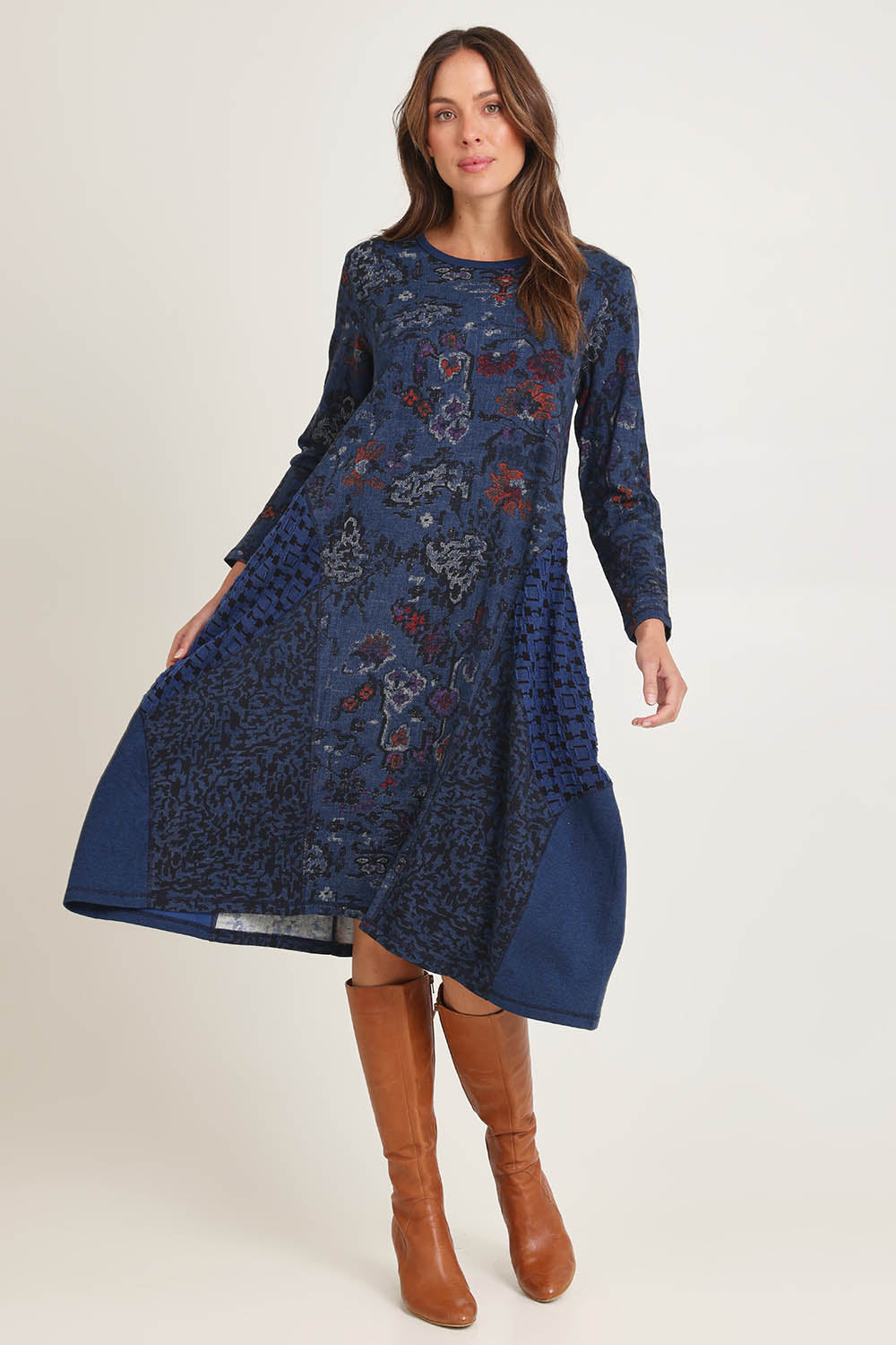 Model Madeline wearing size 10 of the Bubble Dress in colour Tabriz (Blue), from the front, showing the whole outfit