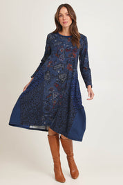 Model Madeline wearing size 10 of the Bubble Dress in colour Tabriz (Blue), from the front, showing the whole outfit