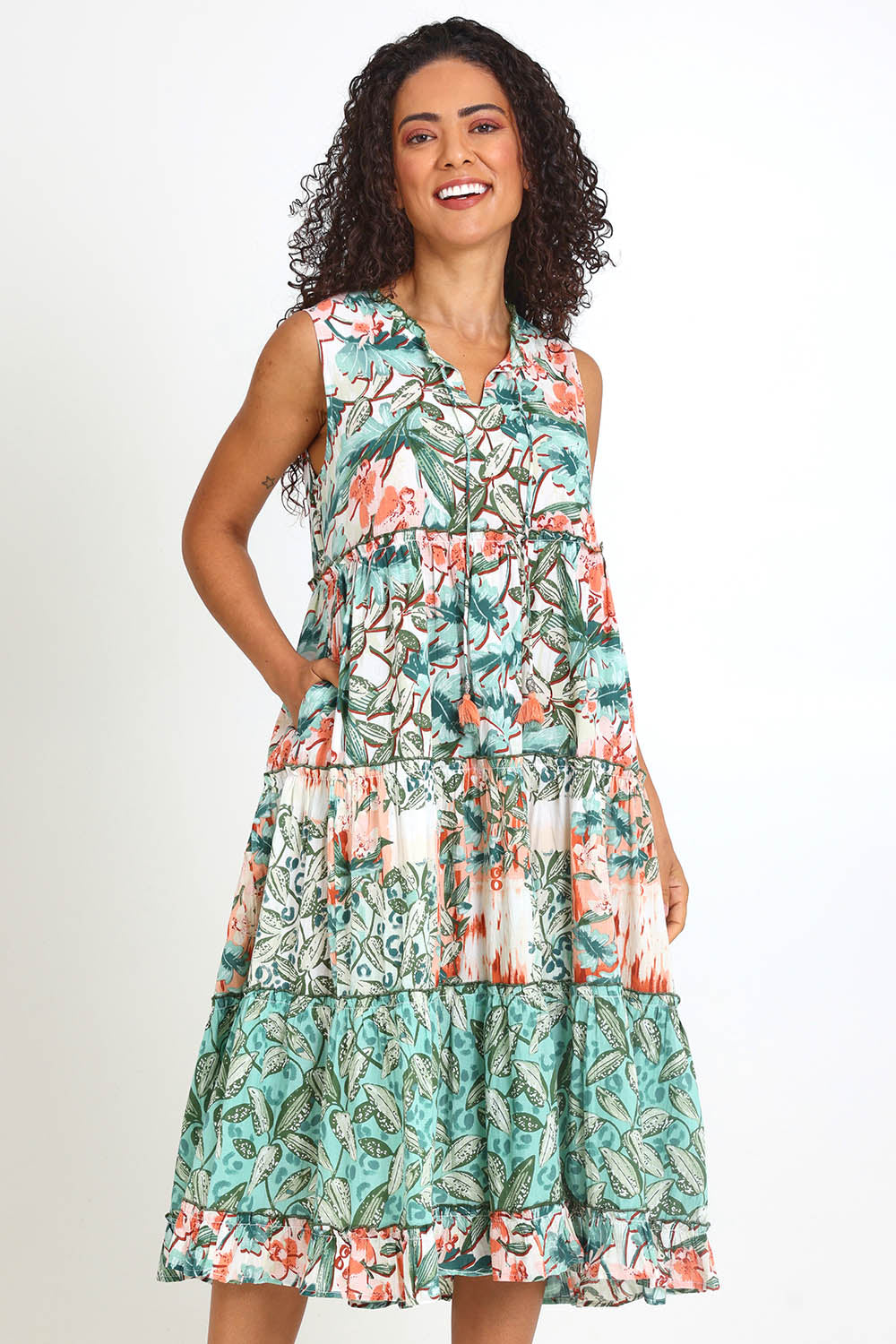 Model Pamelar wearing size 10 of the Sleeveless Layers Dress – Print in colour Print, in a cropped view