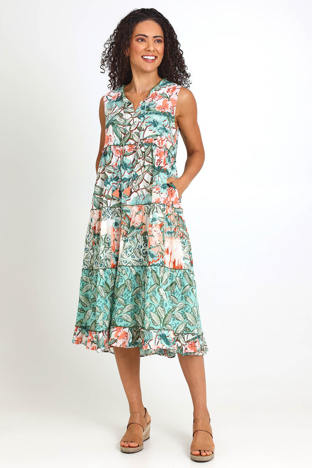 Model Pamelar wearing size 10 of the Sleeveless Layers Dress – Print in colour Print, from the front