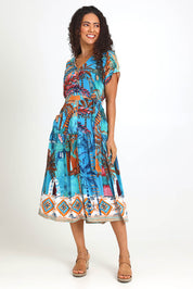 Model Pamelar wearing size 10 of the V-Neck Button Through Dress – Print in colour Print, from the front