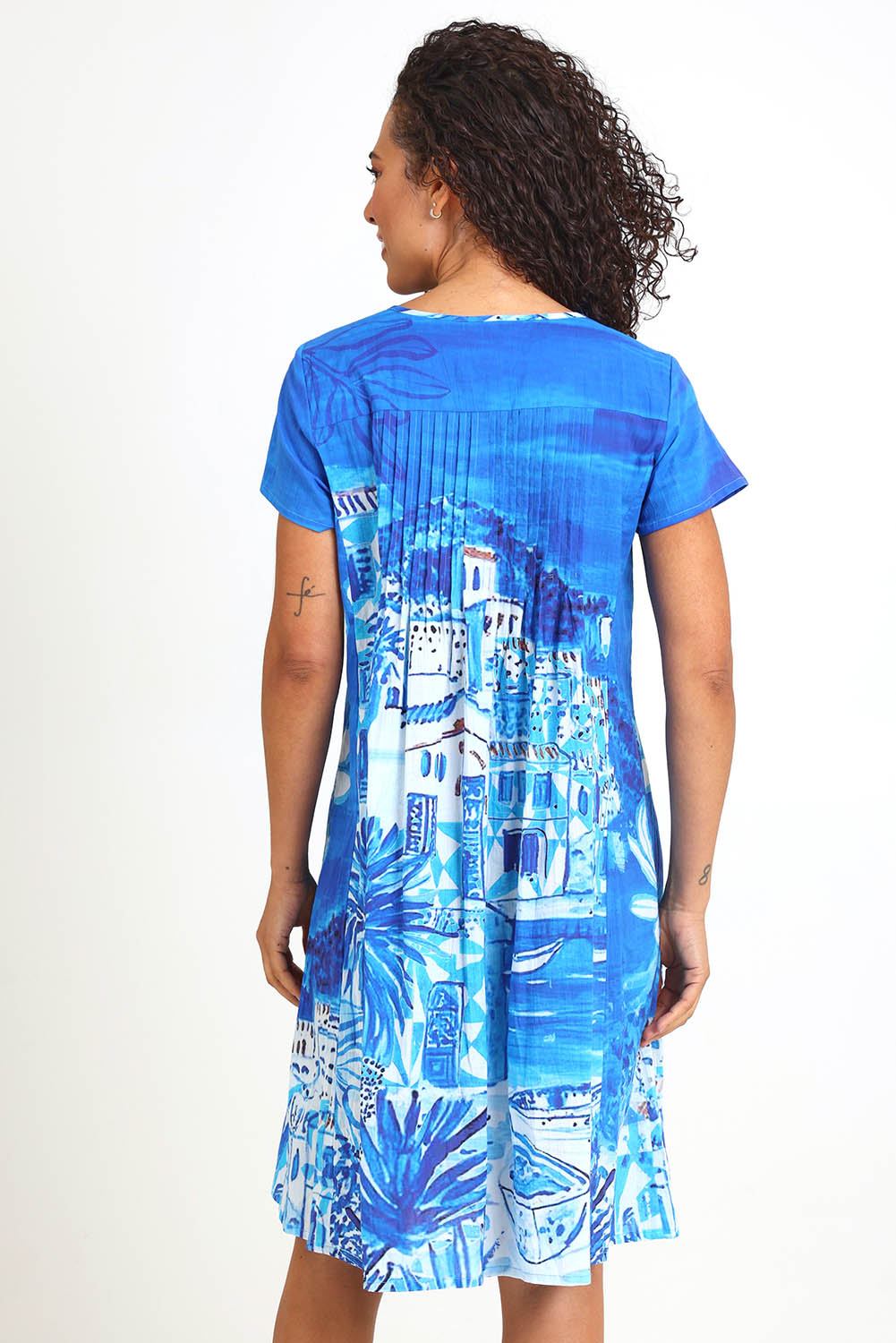 Model Pamelar wearing size 10 of the Easy Fit Dress – Island in colour Island, from the back