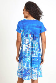 Model Pamelar wearing size 10 of the Easy Fit Dress – Island in colour Island, from the back