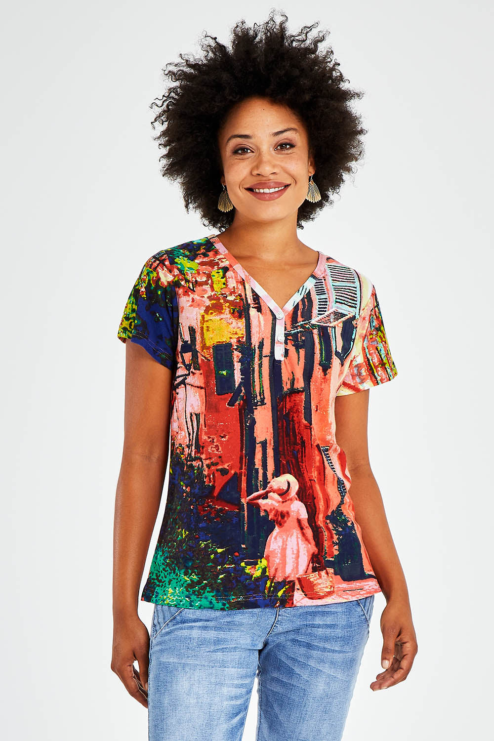 Model Olivia wearing size 10 of the Ville Cora Organic Cotton Tee in colour Villecora (Pink), from the front, cropped image