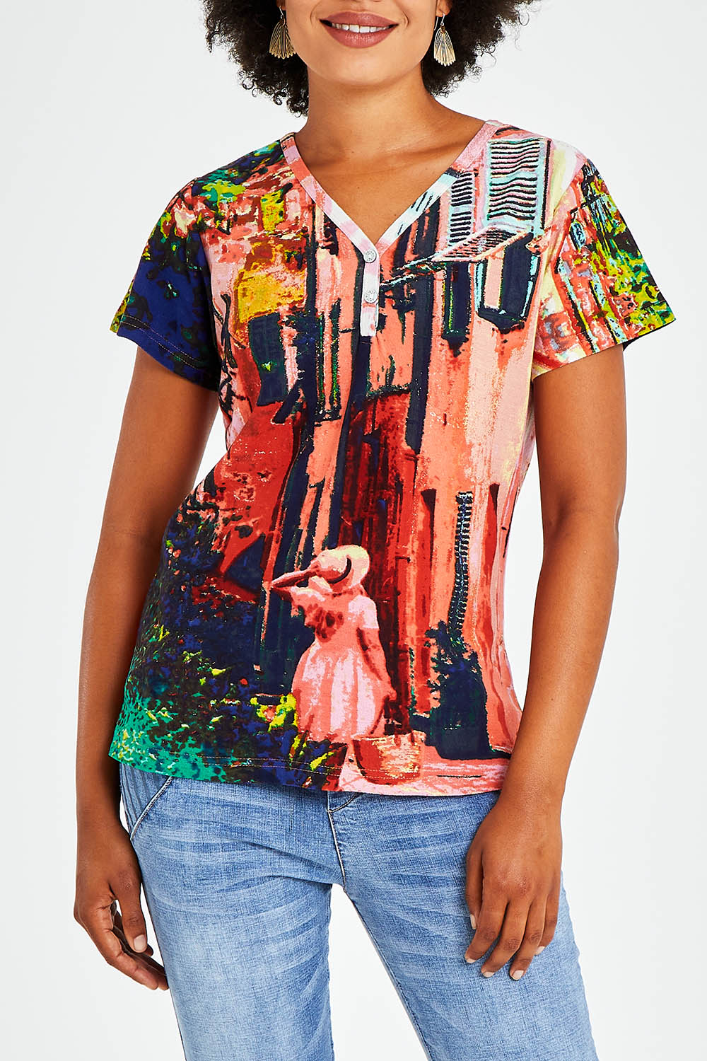 Model Olivia wearing size 10 of the Ville Cora Organic Cotton Tee in colour Villecora (Pink), from the front, cropped image