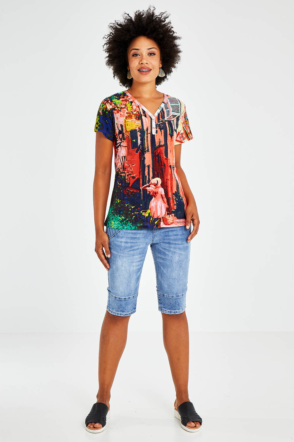 Model Olivia wearing size 10 of the Ville Cora Organic Cotton Tee in colour Villecora (Pink), from the front, showing the whole outfit
